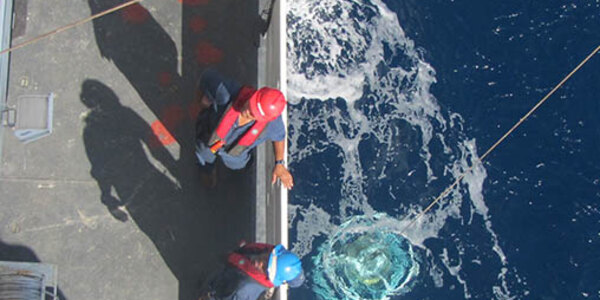 Photo of CTD instrument deployment in ocean