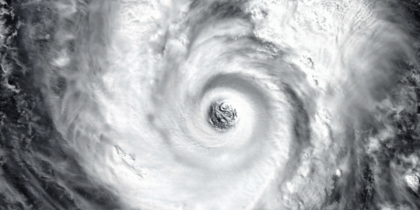 Eye of a hurricane over black background. 