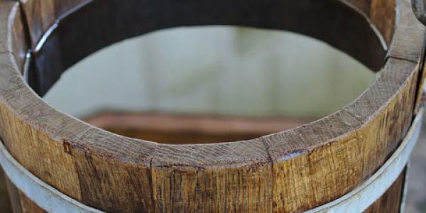 Photo of a wooden bucket filled with water