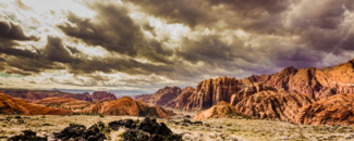 Summer storm in the Badlands, with dark clouds above the mountains Summer storm in the Badlands, with dark clouds above the mountains