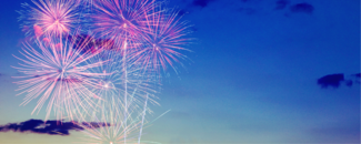 Fireworks bursting against a blue sky. Fireworks bursting against a blue sky.