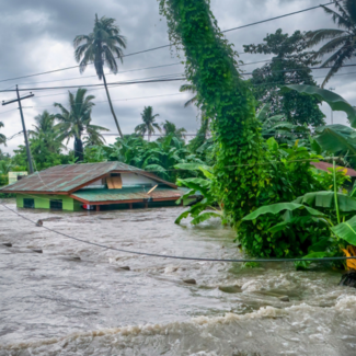 A rural home being submerged by floodwaters caused by torrential rain in Baco, Oriental Mindoro, Philippines on July 23, 2021.