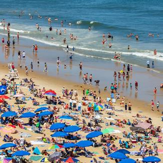 Photo of a crowded beach covered with umbrellas in Ocean City, Maryland, courtesy of iStock