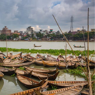 A bunch of passenger boats in the Buriganga River near Dhaka, Bangladesh