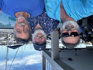  NCEI’s Jeff Arnfield, Rost Parsons, and Scott Cross pose before the Gulfstreamer Race in May 2024. 