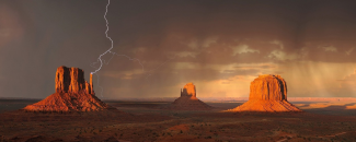 Photo of lightning over Monument Valley in Arizona Photo of lightning over Monument Valley in Arizona