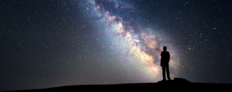 Assessing the Global Climate in June 2024 Silhouette of a person staring at the Milky Way