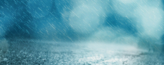 Photo of rain on pavement with blue background Photo of rain on pavement with blue background