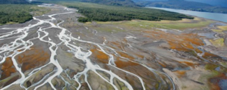 Braided streams of the Grewingk Glacier River in Alaska. Retreating glaciers carry large volumes of sediment, producing braided streams with multiple channels. Braided streams of the Grewingk Glacier River in Alaska. Retreating glaciers carry large volumes of sediment, producing braided streams with multiple channels.