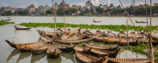 A bunch of passenger boats in the Buriganga River near Dhaka, Bangladesh. A bunch of passenger boats in the Buriganga River near Dhaka, Bangladesh.