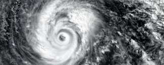 Unlocking Hurricane Insights Eye of a hurricane over black background.