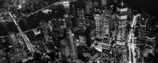 Black and white photo of New York City at night Black and white photo of New York City at night