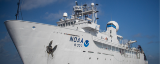 NCEI Scientist at Sea: From Collection to Archive The NOAA Okeanos Explorer docked at port.