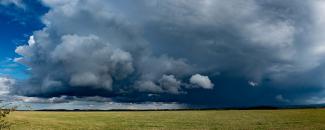 Photo of storm clouds over a field Photo of storm clouds over a field